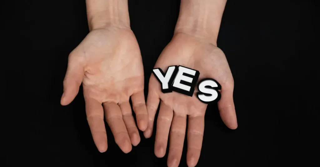 hands hlding a "YES" a weight loss affirmation